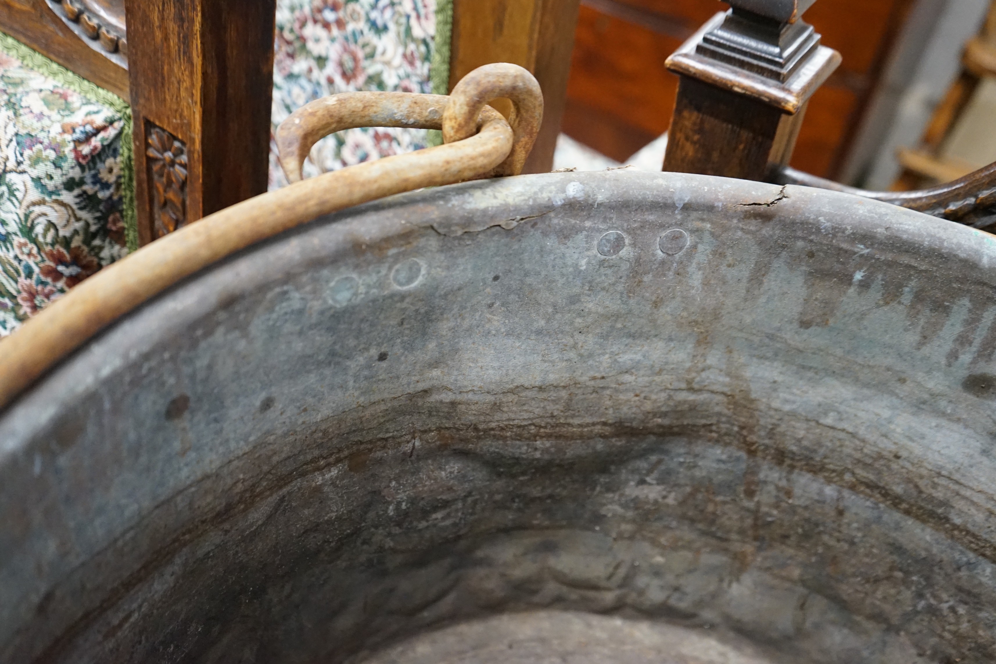 A Victorian brass and wrought iron cauldron with wrought iron swing handle, diameter 56cm, height 35cm